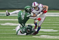 New York Jets defenders try to tackle Buffalo Bills' Cole Beasley, right, during the second half of an NFL football game, Sunday, Oct. 25, 2020, in East Rutherford, N.J. (AP Photo/John Minchillo)