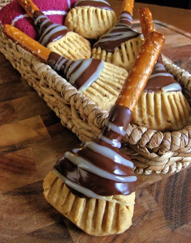<p>This is not your average witch's broomstick. It's got a pretzel rod handle that makes way for a cookie broom adorned with a silky chocolate drizzle. </p><p><strong>Get the recipe: </strong><a href="http://www.thedragonskitchen.com/2010/10/witchs-broomstick-cookies.html" rel="nofollow noopener" target="_blank" data-ylk="slk:Witch's Broomstick Cookies;elm:context_link;itc:0;sec:content-canvas" class="link ">Witch's Broomstick Cookies</a></p>