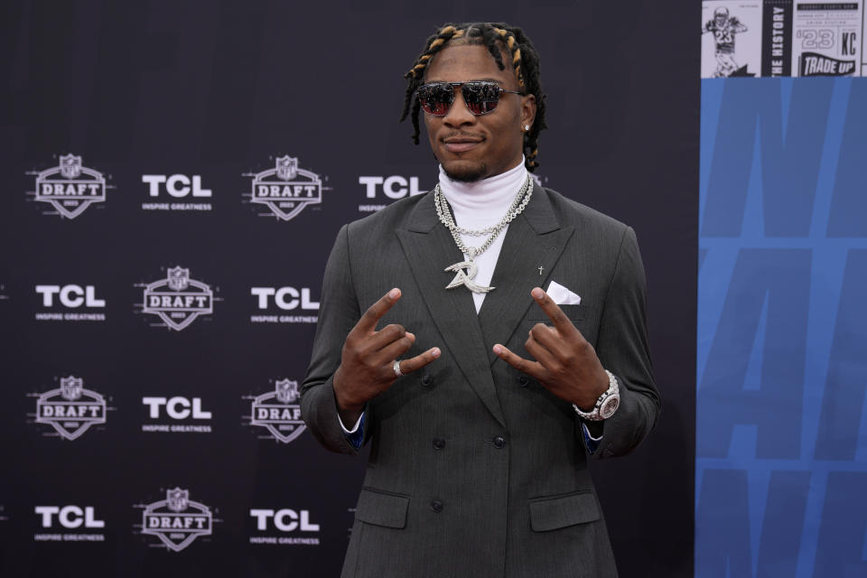 Florida quarterback Anthony Richardson arrives on the red carpet before the first round of the NFL football draft, Thursday, April 27, 2023, in Kansas City, Mo. (AP Photo/Charlie Riedel)