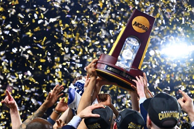 The Connecticut Huskies celebrate after defeating the San Diego State Aztecs to win the NCAA Men's Basketball Tournament National Championship in 2023. - Credit: Brett Wilhelm/NCAA Photos/Getty Images