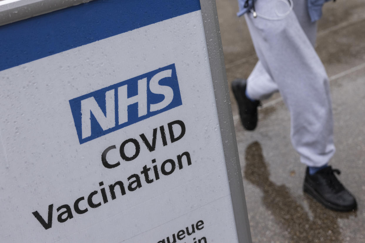 LONDON, UNITED KINGDOM - SEPTEMBER 13: A Covid-19 vaccination centre sign stands in the rain at St Thomas' hospital on September 13, 2021 in London, United Kingdom. Tomorrow, British Prime Minister Boris Johnson will set out his plan to manage Covid-19 through the winter, including what actions would need to be taken if the NHS hospital system were at risk of being overwhelmed. (Photo by Dan Kitwood/Getty Images)