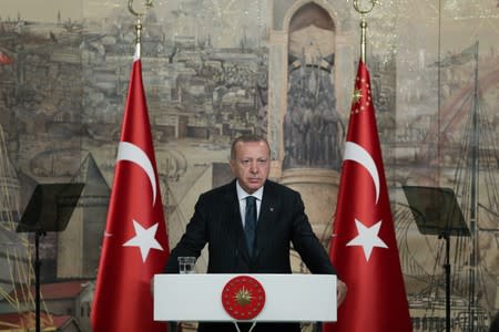 Turkish President Erdogan speaks during a meeting with members of the international media in Istanbul