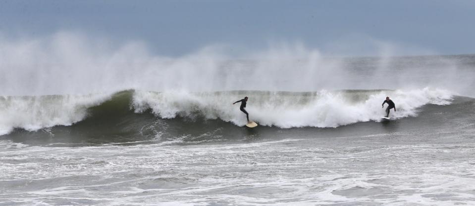 Surfers at North Beach in Hampton take advantage of waves boosted by Hurricane Lee out to sea Saturday, Sept. 16, 2023.