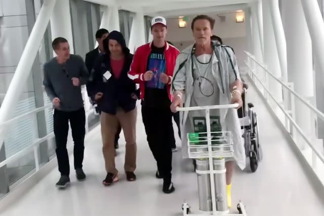 <p>The Pump/YouTube</p> Arnold Schwarzenegger's friends motivating him to walk after open heart surgery