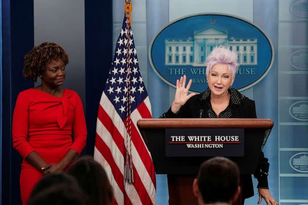 White House Press Secretary Karine Jean-Pierre observes as Cyndi Lauper, who will be performing at the signing ceremony for the 'Respect for Marriage Act,' addresses reporters during the daily press briefing at the White House in Washington, Dec. 13,2022. (Kevin Lamarque/Reuters)