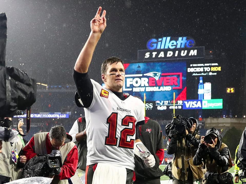 Tom Brady walks off the field after a win over the New England Patriots.