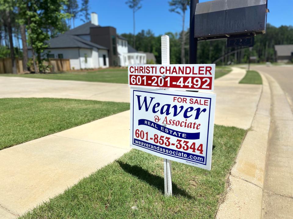 A for sale sign sits outside a home in Madison County. Interest rates are on the rise and Matt Wilson, president of the Mississippi Mortgage Bankers Association, said those in the industry did not expect rates to stay as low as they did for so long.