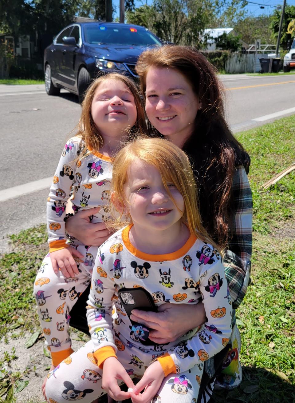 Tiffany Ketchmark poses with her daughters, Jade and Jailyn, at her father's house in Lakeland. Ketchmark evacuated her apartment in Fort Myers and said it was flooded by Hurricane Ian.
