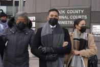 Actor Jussie Smollett, center, departs Tuesday, Dec. 7, 2021, with his mother Janet, left, and an unidentified sister the Leighton Criminal Courthouse after day six of his trial in Chicago. Closing arguments will begin Wednesday, in Chicago. (AP Photo/Charles Rex Arbogast)