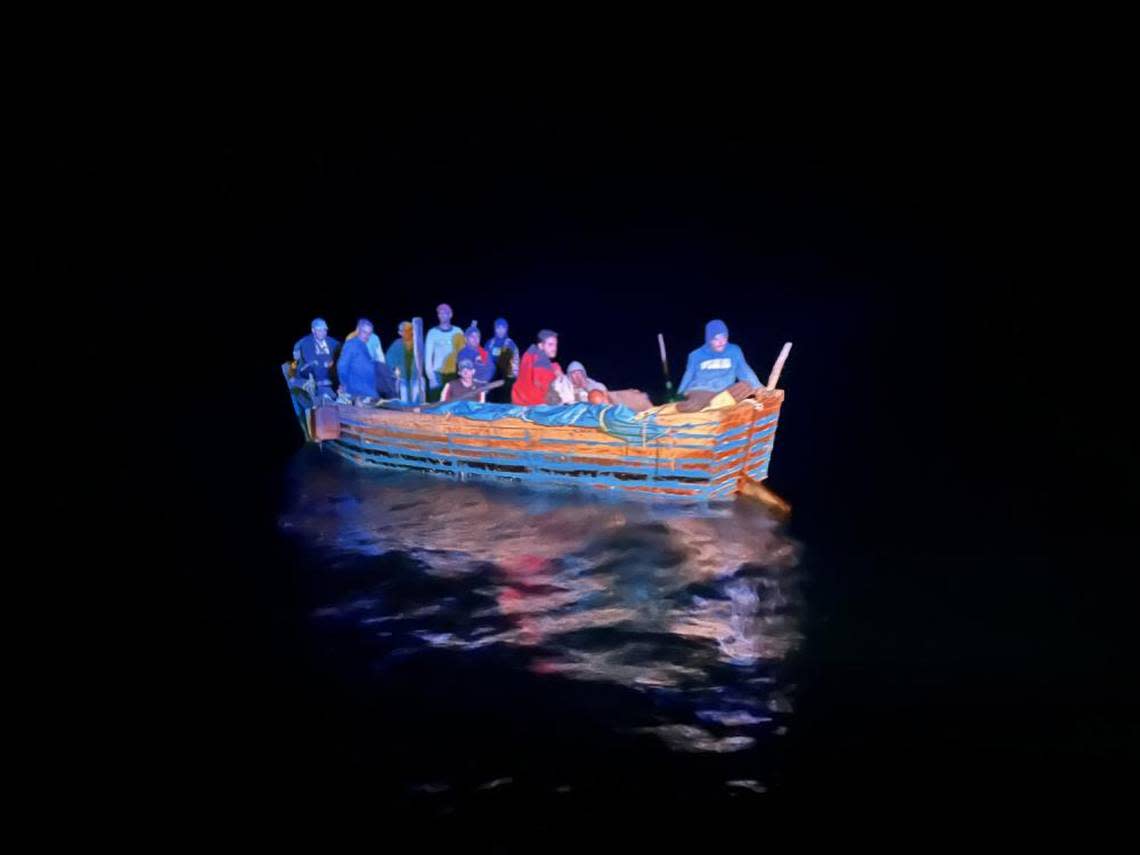 A group of people from Cuba sail on a migrant boat about 50 miles east of Key Largo on Dec. 13, 2022. Another migrant boat capsized Sunday, Dec. 18, 2022, which prompted a U.S. Coast Guard search for nine people off Palm Beach County.