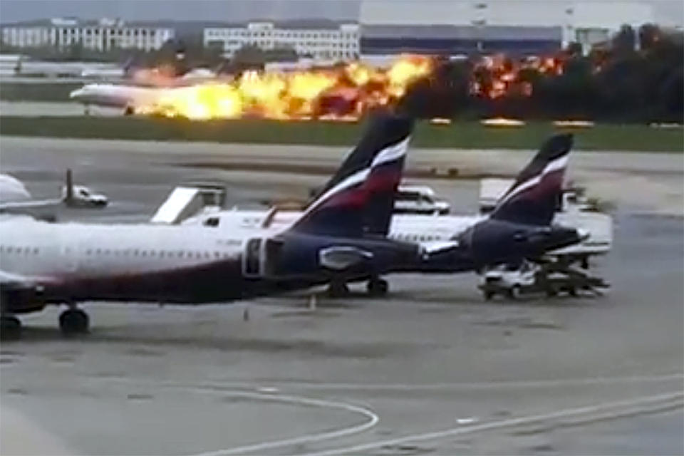 This image taken from video provided by Instagram user @artempetrovich, shows the SSJ-100 aircraft of Aeroflot Airlines on fire during an emergency landing in Sheremetyevo airport in Moscow, Russia, Sunday, May 5, 2019. (@artempetrovich via AP)