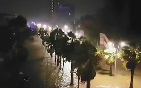  powerful winds and rain of hurricane Maria battering the Faidherbe boulevard along the City House (L) of Pointe-a-Pitre on the French overseas Caribbean island of Gaudeloupe - Credit: LOLY_FWI/AFP/Getty