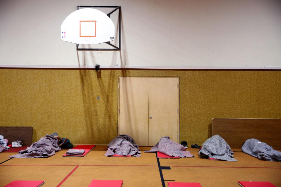 People settle in for the night at the warming shelter at South Salem Friends Church on Oct. 29.