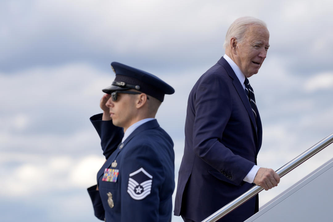 President Joe Biden, right, boards Air Force One at Andrews Air Force Base, Md., Friday, April 12, 2024, enroute to New Castle, Del. (AP Photo/Pablo Martinez Monsivais)