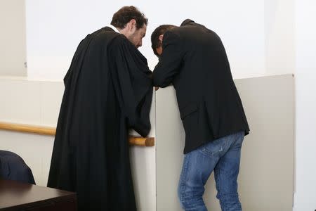 Former trader Jerome Kerviel (R) and his lawyer David Koubbi (L) stand inside the courthouse in Versailles, France, September 23, 2016. REUTERS/Charles Platiau