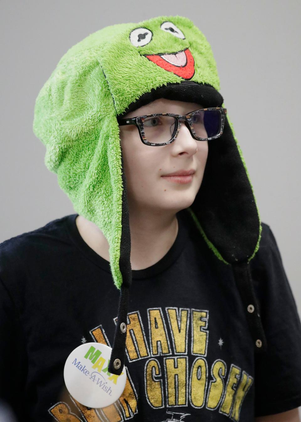 Maxx Ball, 10, of Winston-Salem, North Carolina, wears a smiling warm hat upon arrival for his Make-A-Wish tour of the Sargento Baker Cheese plant,Tuesday, November 22, 2022, in St. Cloud, Wis. Ball has beaten Ewing Sarcoma, a form of bone cancer.