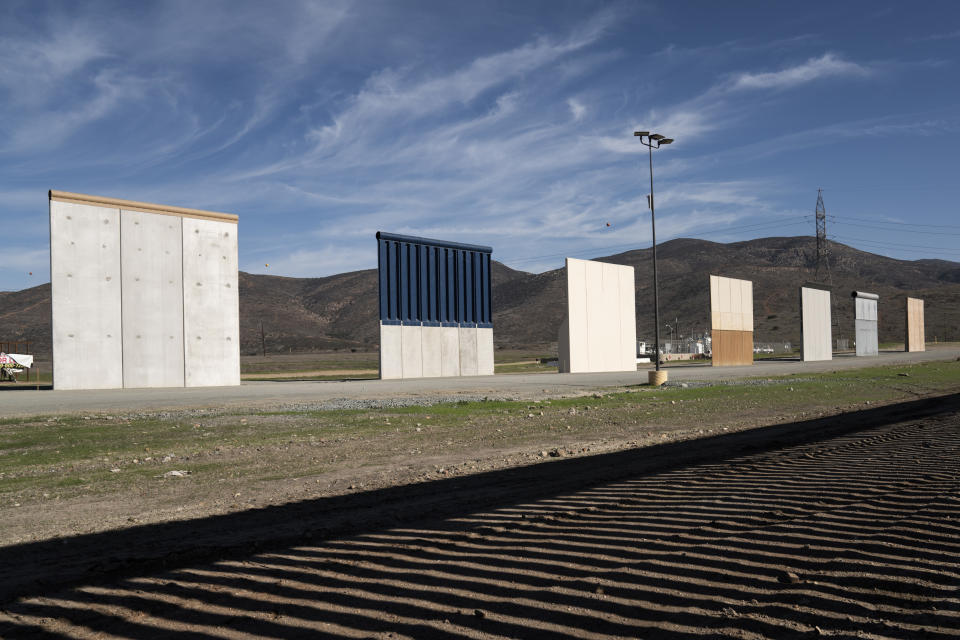 Border wall prototypes stand in San Diego near the Mexico U.S. border, seen from Tijuana, Saturday, Dec. 22, 2018. The U.S. federal government remains partially closed in a protracted standoff over President Donald Trump's demand for money to build a border wall with Mexico. (AP Photo/Daniel Ochoa de Olza)