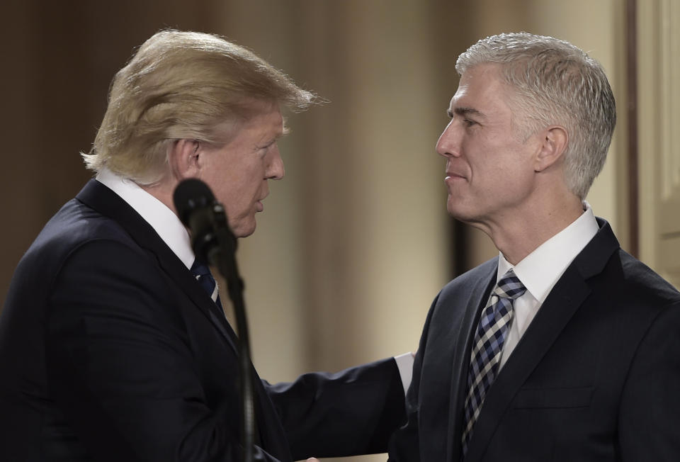 Judge Neil Gorsuch (R) speaks with US President Donald Trump after he was nominated for the Supreme Court, at the White House in Washington, DC, on January 31, 2017.&nbsp;