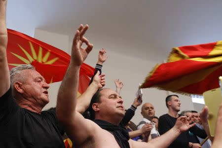 Protesters entered Macedonia's parliament after the governing Social Democrats and ethnic Albanian parties voted to elect an Albanian as parliament speaker in Skopje. Macedonia April 27, 2017. REUTERS/Ognen Teofilovski