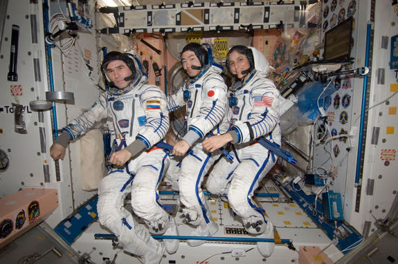 n the International Space Station's Unity node, NASA astronaut Sunita Williams, Expedition 33 commander; along with Japan Aerospace Exploration Agency astronaut Aki Hoshide (center) and Russian cosmonaut Yuri Malenchenko (left), both flight eng