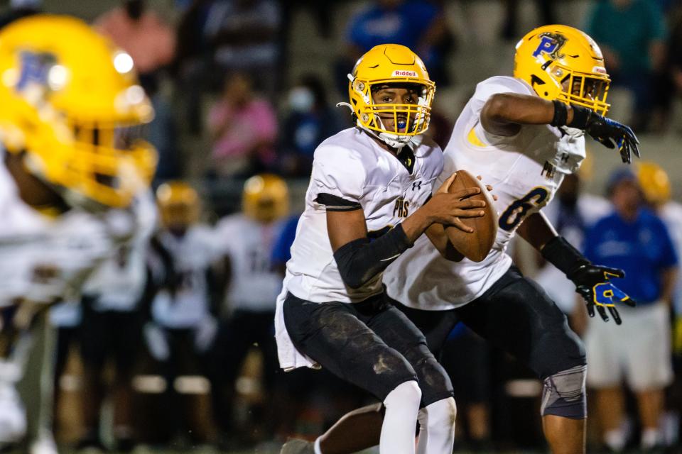 Palatka's Tommy Offord (10) drops back to pass against Gainesville Eastside on Nov. 10.