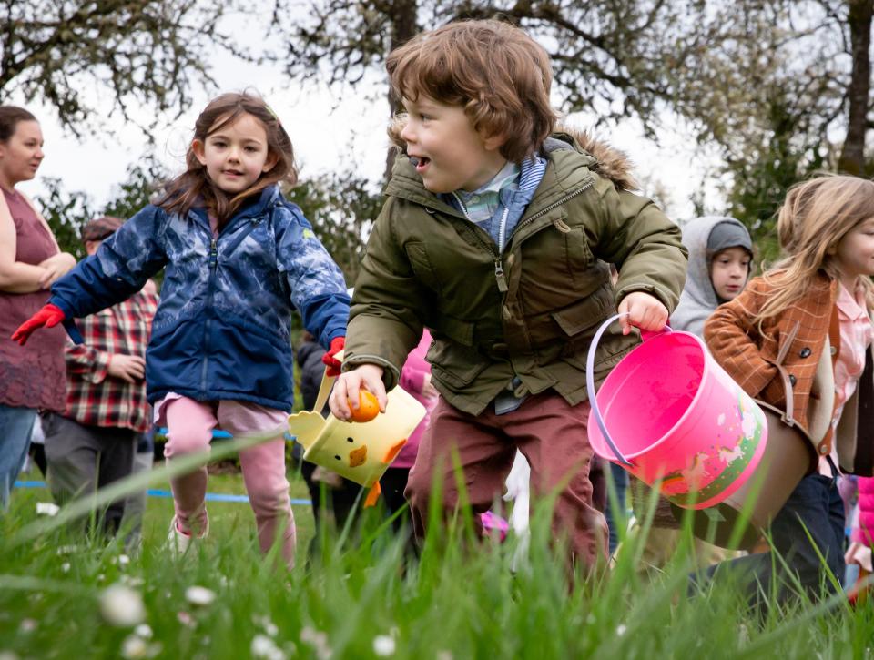 Dalton, 4, collects an egg at Willamalane’s annual “Megga” Easter egg hunt at Lively Park in Springfield in April 2023.