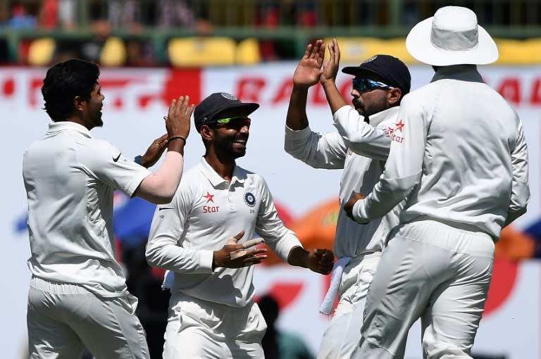 India celebrate the wicket of Australia's Matthew Renshaw on the third day of the fourth Test in Dharamsala on March 27, 2017