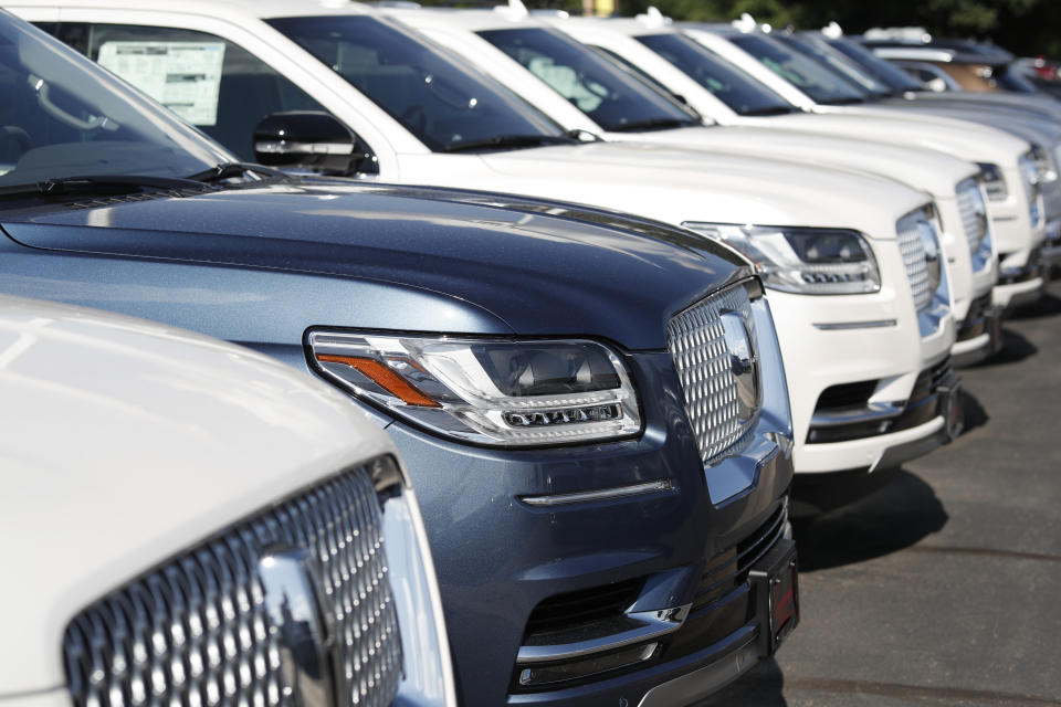 FILE - In this July 28, 2019, file photo unsold 2019 Lincoln Navigators sit at a dealership in Englewood, Colo. On Tuesday, Sept. 24, the Conference Board releases its September index on U.S. consumer confidence. (AP Photo/David Zalubowski, File)