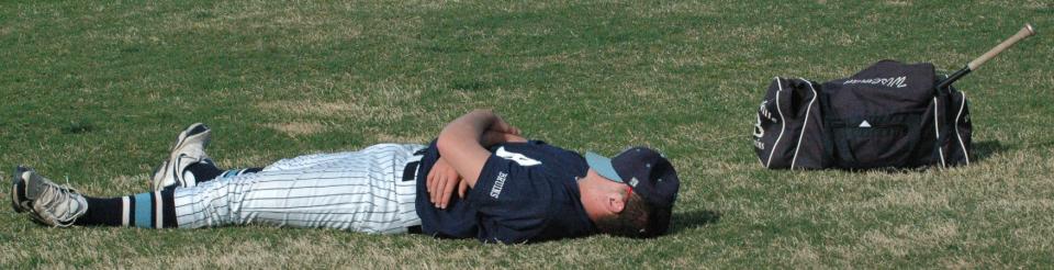 A MOMENT THAT WAS: Bartlesville High baseball player Jack Wiseman doesn't let an idle moment pass by without enjoying a welcome breather, sometime around 2009 or 2010. Wiseman went on to shine on the college gridiron as a ballcarrier for four years for Hillsdale College in Michigan.