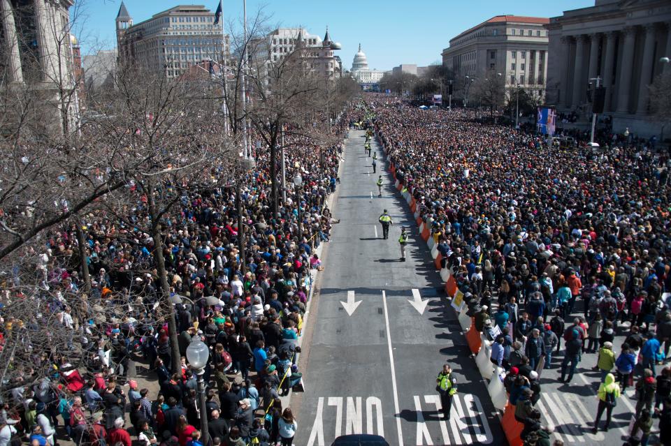 People take part in the March For Our Lives rally against gun violence in Washington, DC on March 24, 2018. Galvanized by a massacre at a Florida high school, hundreds of thousands of Americans are expected to take to the streets in cities across the United States on Saturday in the biggest protest for gun control in a generation.