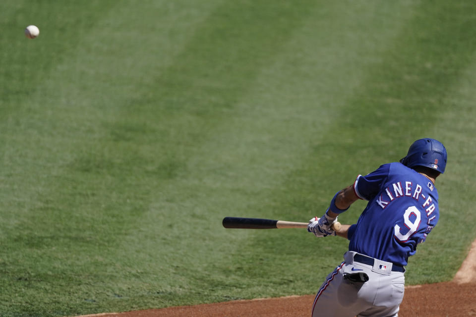 Texas Rangers' Isiah Kiner-Falefa hits a home run during the first inning of a baseball game against the Los Angeles Angels, Monday, Sept. 21, 2020, in Anaheim, Calif. (AP Photo/Ashley Landis)