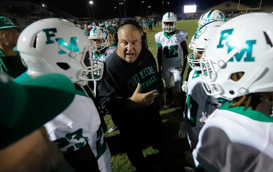 Fort Myers coach Sammy Sirianni addresses his players on the field during a time-out. The Fort Myers High School football team defeated Charlotte by a final score of 44-18 on Friday, September 22, 2023. The victory marked a historic 700th win for Fort Myers. 

Ricardo Rolon/USA TODAY NETWORK-FLORIDA
