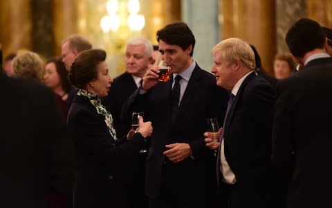 Princess Anne chats with Justin Trudeau and Boris Johnson at Buckingham Palace - Credit: Geoff Pugh for the Telegraph