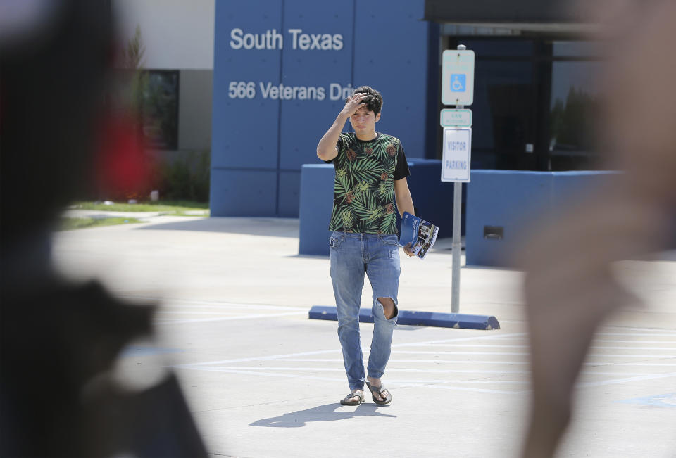 U.S. citizen Francisco Galicia, 18, walks out on his own from the South Texas Detention Facility in Pearsall, Texas, Tuesday, July 23, 2019. Galicia who was born in the U.S. has been released from immigration custody after wrongfully being detained for more than three weeks. Galicia was traveling north with a group of friends when they were stopped at a Border Patrol inland checkpoint, and he was detained for three weeks by the Border Patrol, then transferred to the ICE detention center. (Kin Man Hui/The San Antonio Express-News via AP)