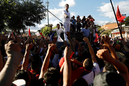 Salvador Nasralla, presidential candidate for the Opposition Alliance Against the Dictatorship, speaks to his supporters during a protest while the country is still mired in chaos over a contested presidential election in Tegucigalpa, Honduras December 3, 2017. REUTERS/Edgard Garrido