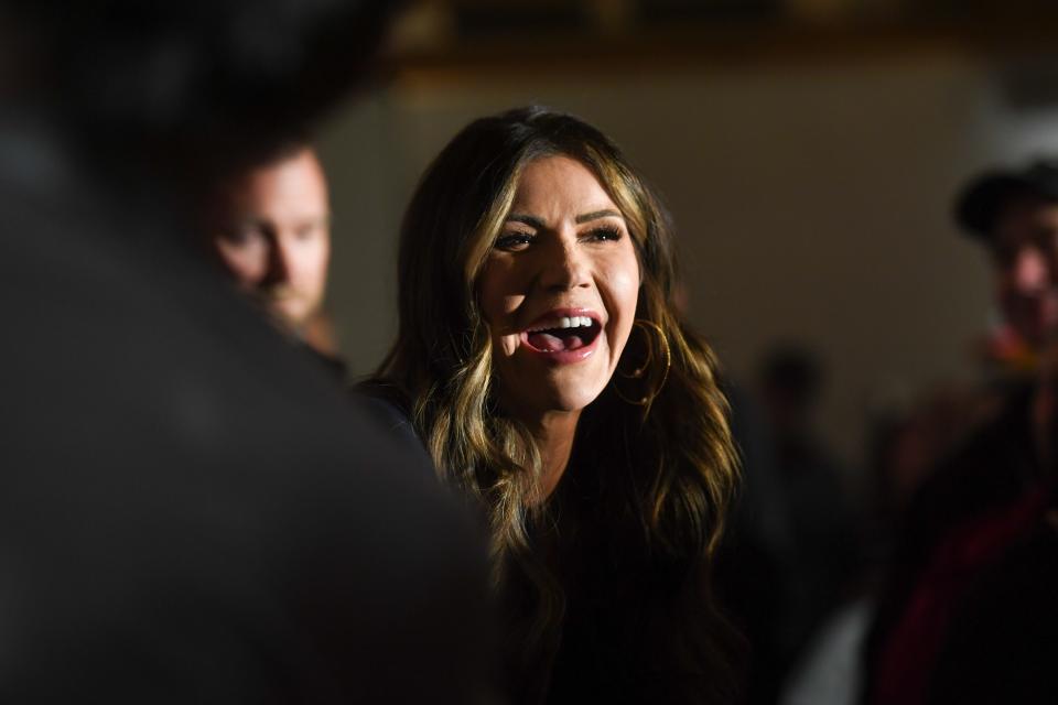 Gov. Kristi Noem socializes with attendees during a caucus event in support of Donald Trump on Wednesday, Jan. 3, 2024 at County Celebrations Center in Sioux City, Iowa.