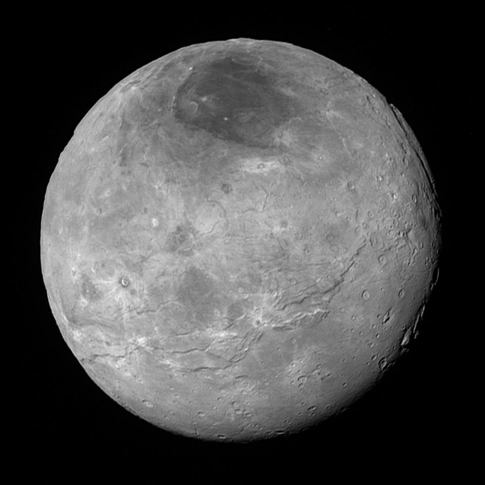 Pluto's largest moon Charon, taken by NASA&acirc;s New Horizons spacecraft 10 hours before its closest approach to Pluto on July 14, 2015 from a distance of 290,000 miles. NASA says the small moon "displays a surprisingly complex geological history, including tectonic fracturing; relatively smooth, fractured plains in the lower right; several enigmatic mountains surrounded by sunken terrain features on the right side; and heavily cratered regions in the center and upper left portion of the disk."