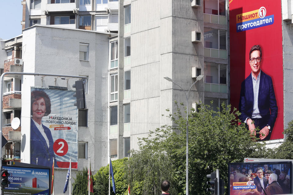 Giant posters of Gordana Siljanovska Davkova, the presidential candidate supported by the center-right main opposition VMRO-DPMNE coalition, left and Stevo Pendarovski, incumbent President and the presidential candidate backed by the ruling social democrats (SDSM), right, are hanging on a building in Skopje, North Macedonia, on Monday, May 6, 2024. Voters go to the polls on Wednesday in North Macedonia to cast ballots for parliamentary election and presidential runoff, for the second time in two weeks. (AP Photo/Boris Grdanoski)