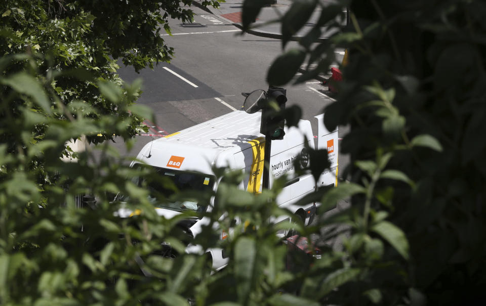 A view of the van, Sunday June 4, 2017, which was used by three attackers which was driven onto London Bridge, striking pedestrians, before they went on a stabbing rampage in nearby Borough Market Saturday evening.  Several people were killed in the terror attack at the heart of London and dozens injured. Prime Minister Theresa May convened an emergency security cabinet session Sunday to deal with the crisis. (Jonathan Brady/PA via AP)