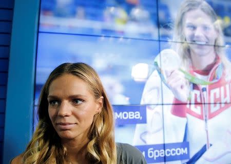 Russia's Olympic medalist Yulia Efimova, who won silver medals for Women's Swimming 100m and 200m Breaststroke, attends a news conference in Moscow, Russia August 24, 2016. REUTERS/Maxim Zmeyev