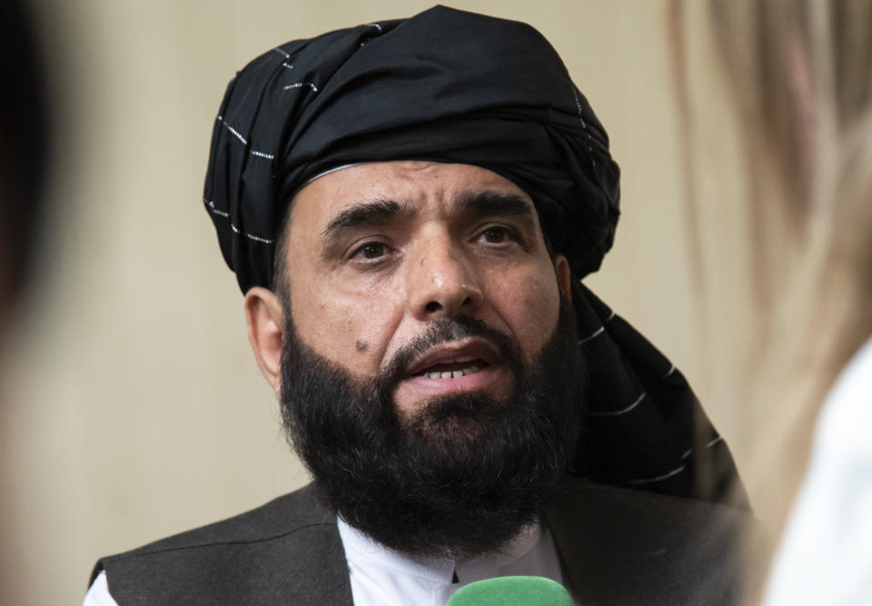 FILE - In this May 28, 2019 file photo, Suhail Shaheen, spokesman for the Taliban's political office in Doha, speaks to the media in Moscow, Russia. The Taliban say they are ready for talks with Afghanistan's political leadership after the Muslim holiday of Eid ul Adha at the end of July 2020, offering to hand over the last of the government prisoners in a week's time, providing the government frees the last of its Taliban prisoners. The offer made by Shaheen in a tweet late Thursday, July 23, 2020 follows one of the most significant shakeups in the Taliban in years. (AP Photo/Alexander Zemlianichenko, File)