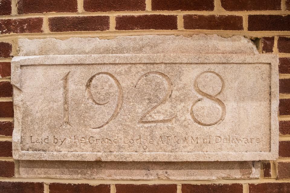A segment of a historic wall of the Everett Meredith Middle School with the date of the completion of the original school.