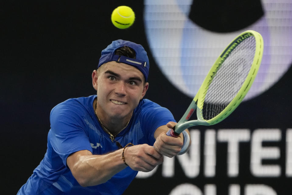 Dalibor Svrcina of the Czech Republic plays a backhand return to Germany's Oscar Otte during their Group C match at the United Cup tennis event in Sydney, Australia, Sunday, Jan. 1, 2023. (AP Photo/Mark Baker)