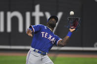 Texas Rangers right fielder Adolis Garcia catches a foul ball hit by Baltimore Orioles' Austin Hays during the third inning of a baseball game Thursday, Sept. 23, 2021, in Baltimore. (AP Photo/Terrance Williams)