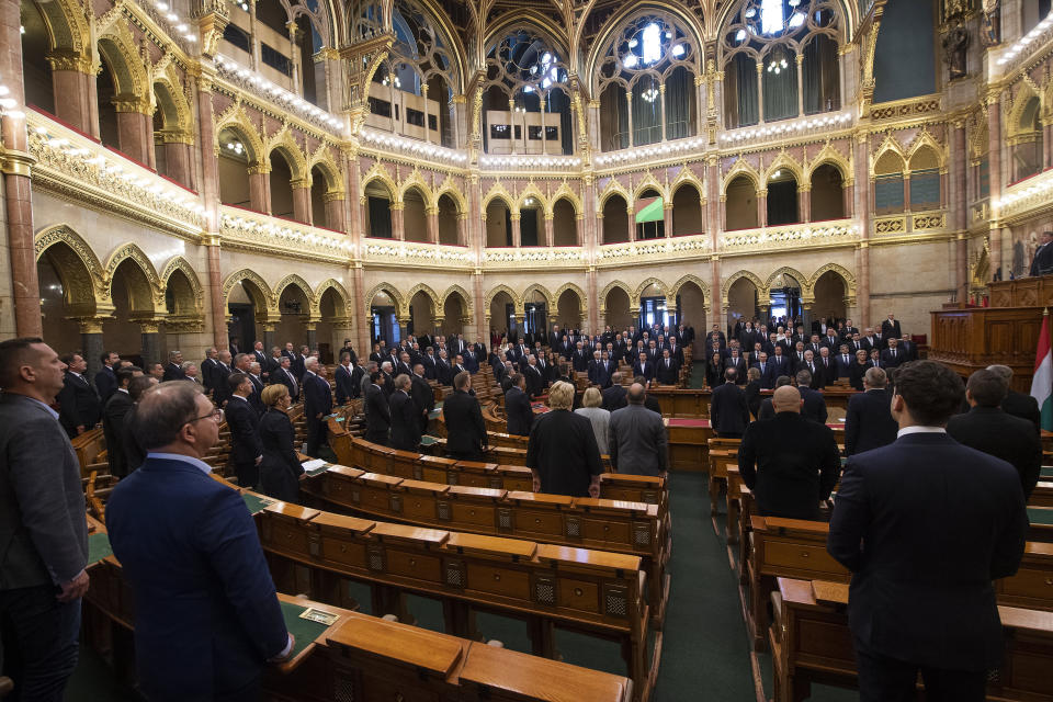 Lawmakers attend the commemorative parliamentary session marking the centenary of the Trianon Peace Treaty in Budapest, Hungary, Thursday, June 4, 2020. Hungary is commemorating the 100th anniversary of a post-World War I peace treaty which led to the loss of about two-thirds of its territory and left some 3.3 million Hungarians outside the country's new borders. (Tibor Illyes/MTI via AP)