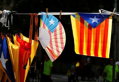 Umbrellas, fans and flags decorated with the Estelada (Catalan separatist flag) are seen on sale during the regional national day 'La Diada' in Barcelona, Spain, September 11, 2017. REUTERS/Albert Gea