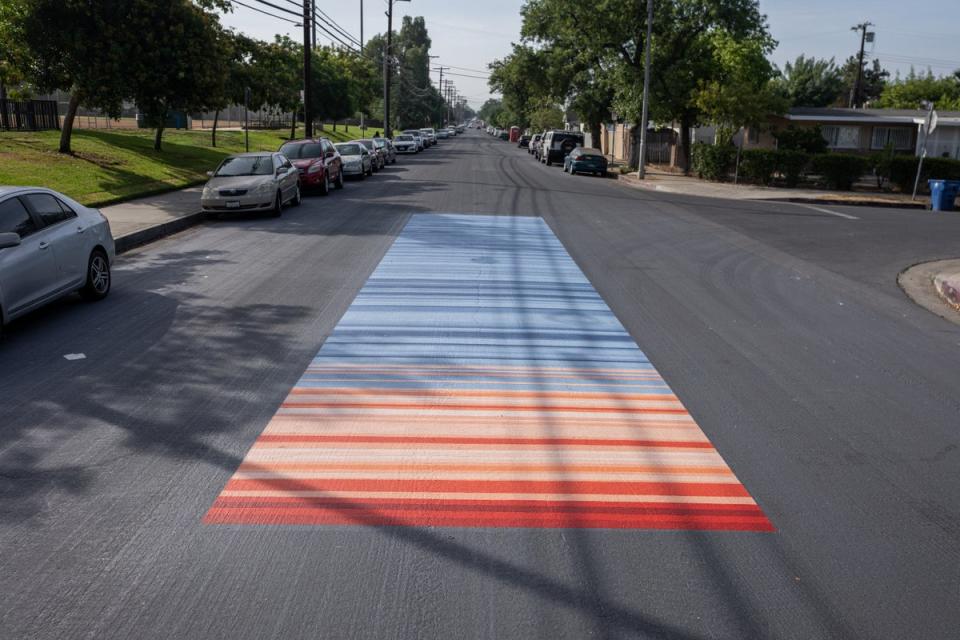 Reflective paint showing “warming stripes”, a depiction of how much the temperature has changed in the area over the years (Courtesy of GAF)