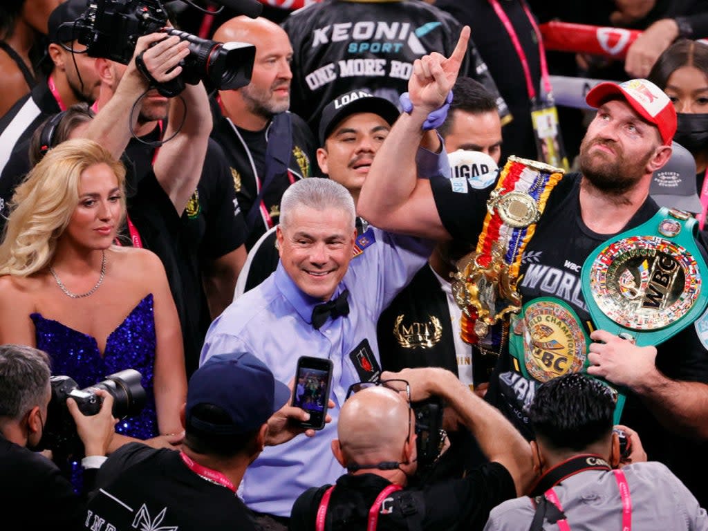 Paris (left) watched her husband Tyson (right) defeat Wilder for a second time in Las Vegas earlier this month (Getty Images)