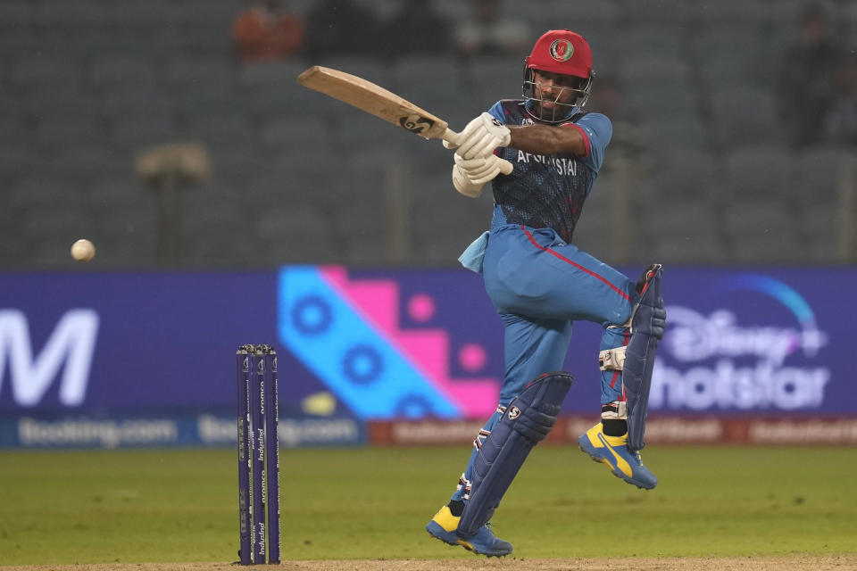 Afghanistan's captain Hashimatullah Shahidi bats during the ICC Men's Cricket World Cup match between Sri Lanka and Afghanistan in Pune, India, Monday, Oct. 30, 2023. (AP Photo/Rajanish Kakade)