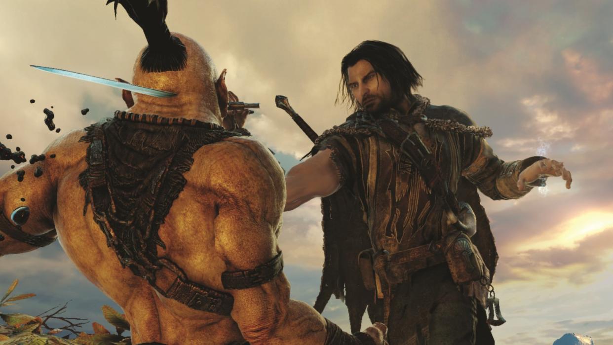  Talion thrusting a blade through the face of an orc. 